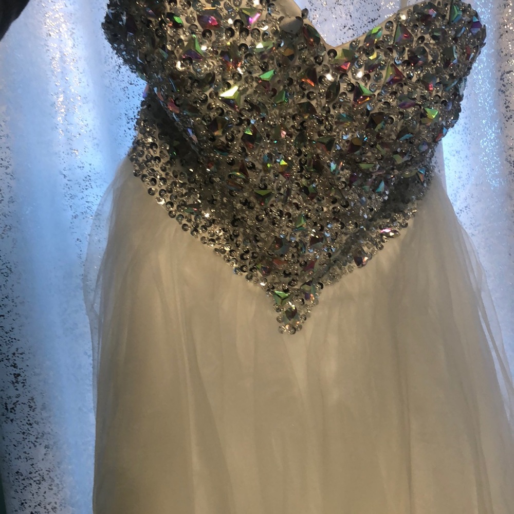 Strapless White jr prom dress with a crystal top.